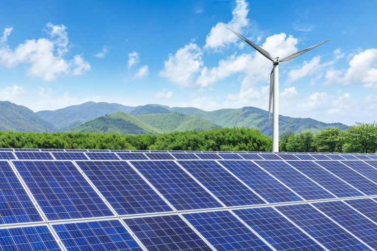 Solar,Panels,And,Wind,Turbines,With,Mountains,Landscape,Under,The